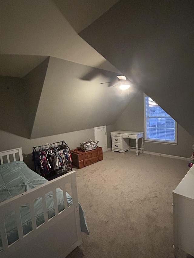 bedroom featuring vaulted ceiling and carpet