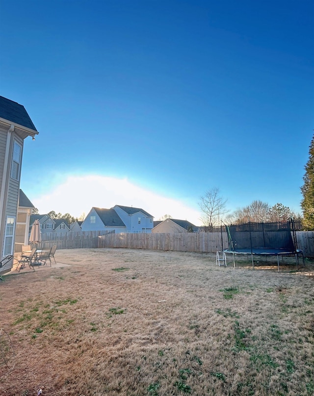 view of yard with a trampoline