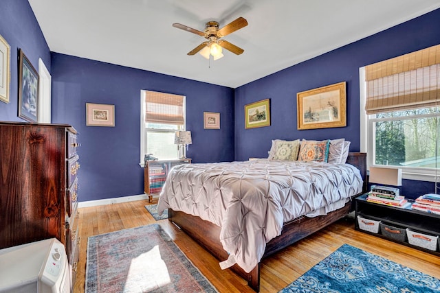 bedroom featuring ceiling fan and light hardwood / wood-style floors