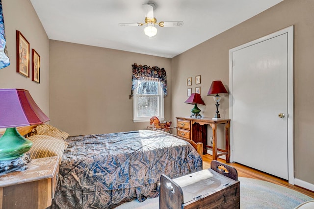 bedroom featuring light hardwood / wood-style floors and ceiling fan