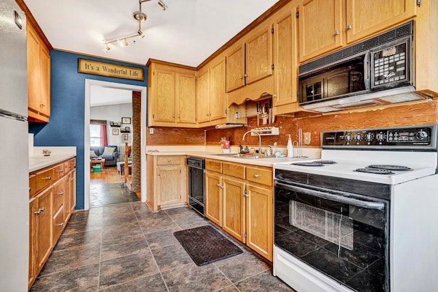 kitchen with decorative backsplash, sink, and black appliances