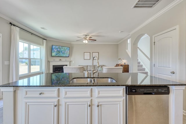 kitchen featuring sink, a center island with sink, stainless steel dishwasher, and white cabinets