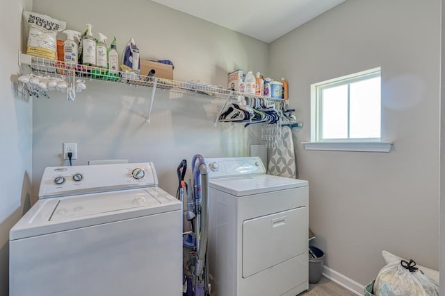 washroom with washing machine and clothes dryer