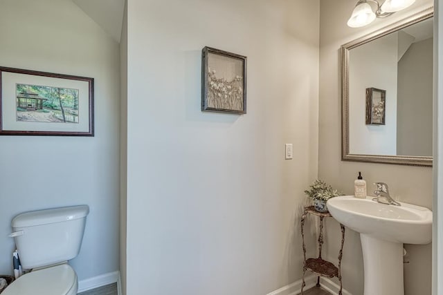 bathroom featuring sink and toilet