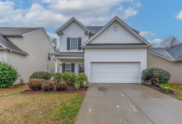 view of front of home with a front yard and a garage