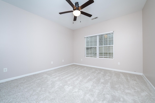 carpeted empty room with ceiling fan