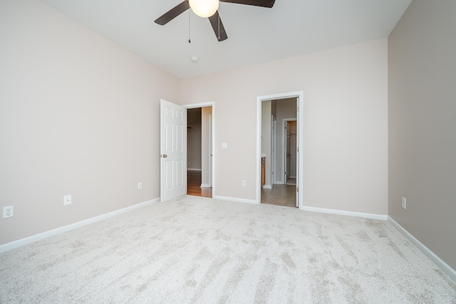 unfurnished bedroom featuring ceiling fan and light colored carpet