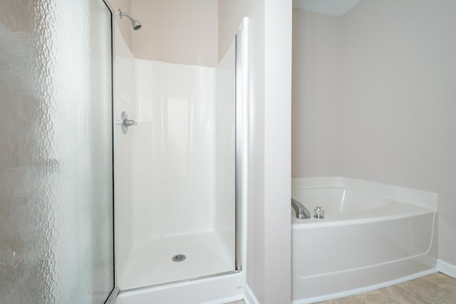 bathroom with independent shower and bath