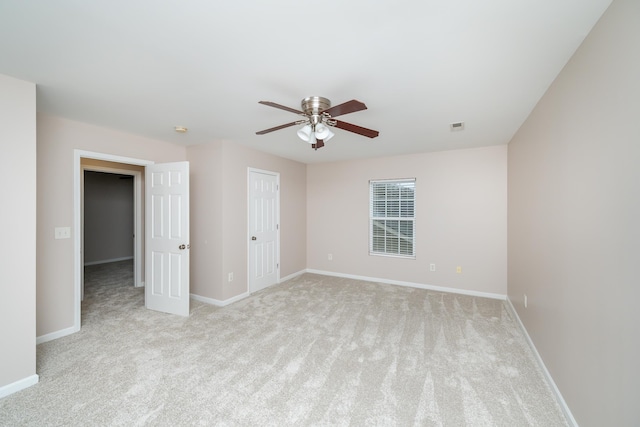 carpeted empty room with ceiling fan