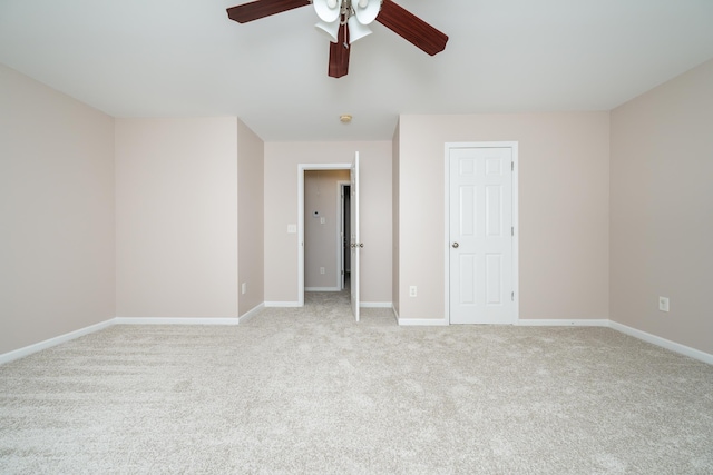 unfurnished bedroom with ceiling fan and light colored carpet