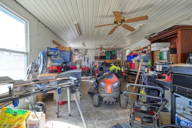 misc room with ceiling fan and concrete floors