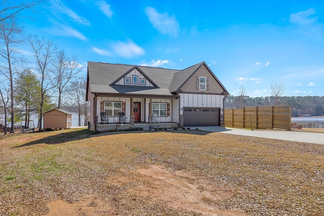 view of front of house with covered porch and a front lawn