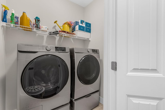 washroom featuring independent washer and dryer