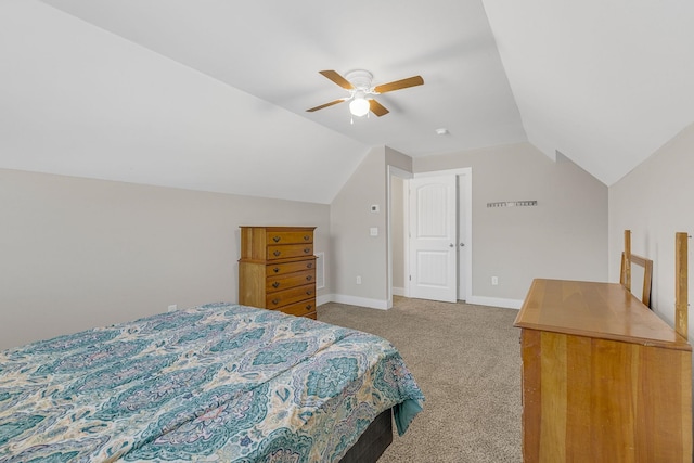 bedroom with ceiling fan, carpet, and lofted ceiling