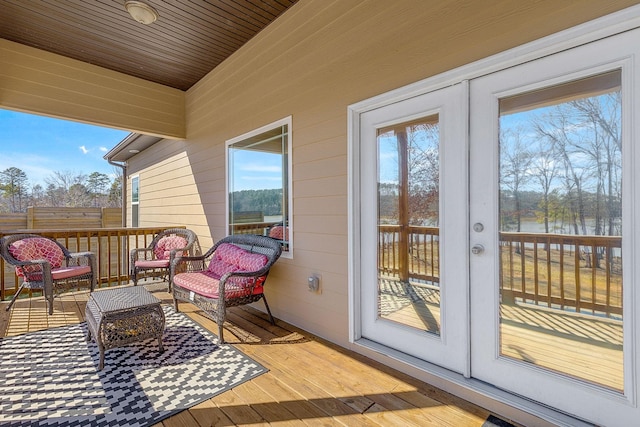 exterior space featuring a water view and french doors