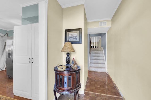 hallway with ornamental molding and dark parquet floors