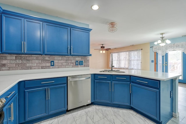 kitchen with dishwasher, blue cabinetry, decorative backsplash, sink, and kitchen peninsula