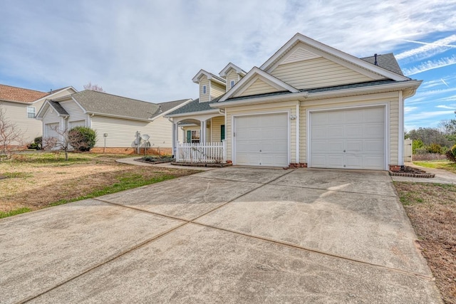 ranch-style house with covered porch, a front yard, and a garage