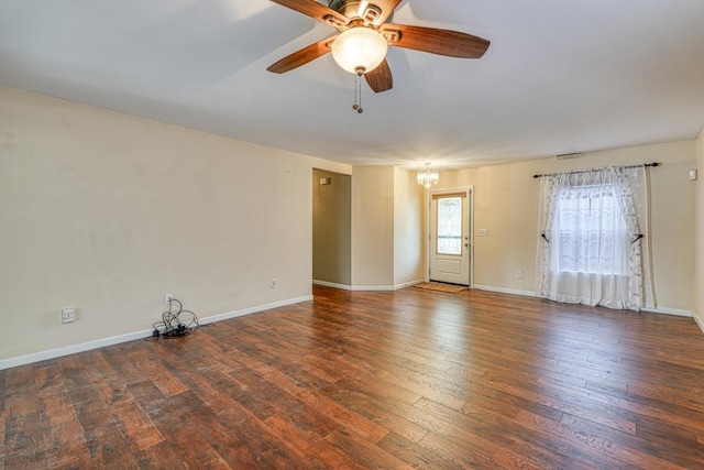 spare room with dark wood-type flooring and ceiling fan