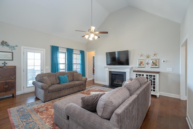 living room with ceiling fan, high vaulted ceiling, and dark wood-type flooring
