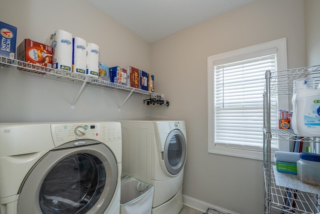 clothes washing area with separate washer and dryer