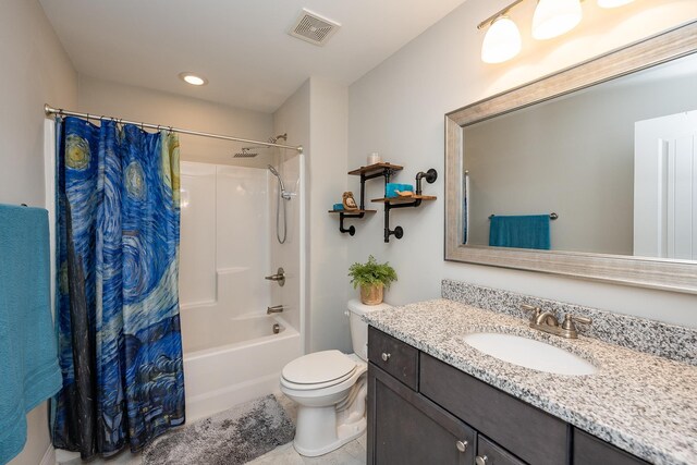 full bathroom with toilet, vanity, and shower / bath combo with shower curtain
