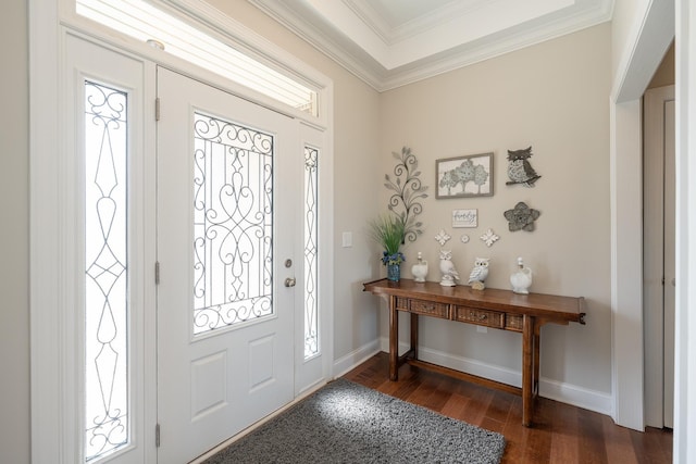 foyer entrance featuring ornamental molding and dark wood-type flooring