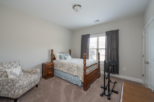 bedroom featuring light carpet