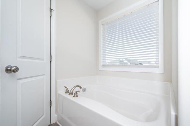 bathroom featuring a bath