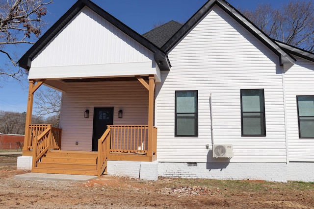 back of property featuring covered porch and ac unit