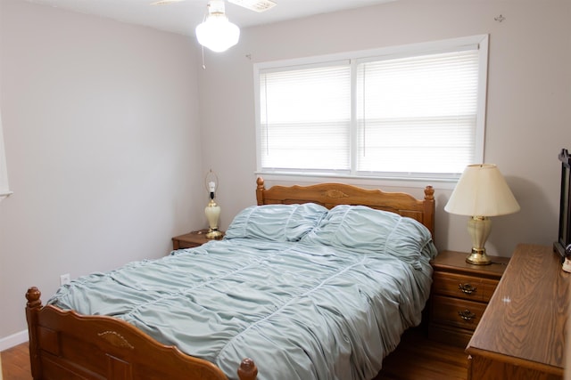 bedroom with hardwood / wood-style flooring