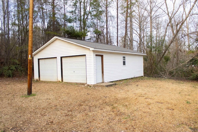 garage with a yard