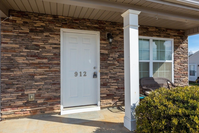 property entrance featuring covered porch