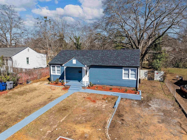 bungalow-style home featuring a front yard