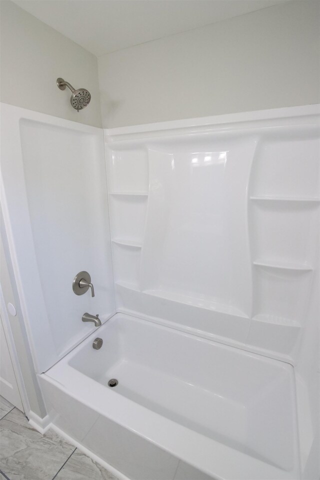 full bathroom featuring shower / bathtub combination and marble finish floor