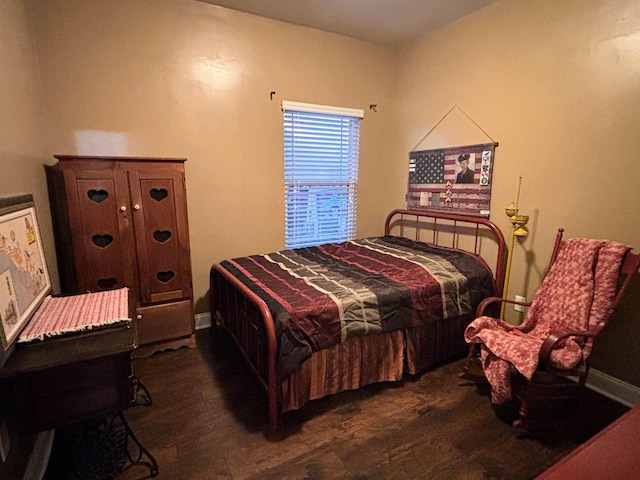 bedroom featuring dark wood-style flooring