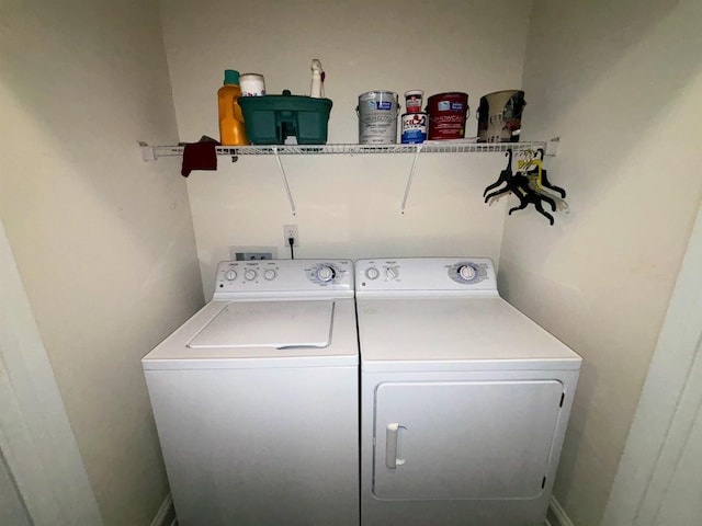 laundry area featuring laundry area and washing machine and clothes dryer