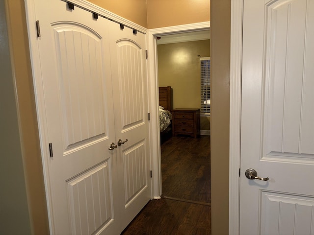 corridor with dark wood finished floors