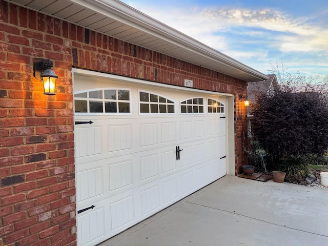 garage with concrete driveway