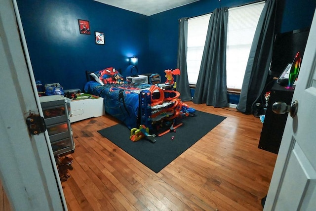 bedroom featuring wood finished floors