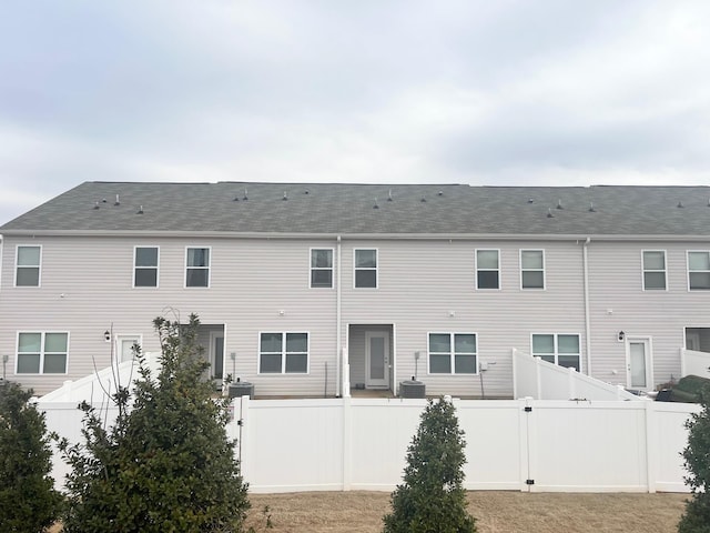 back of house featuring a fenced backyard