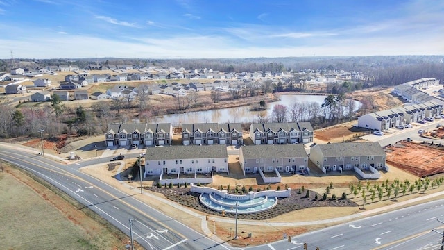 bird's eye view featuring a residential view and a water view