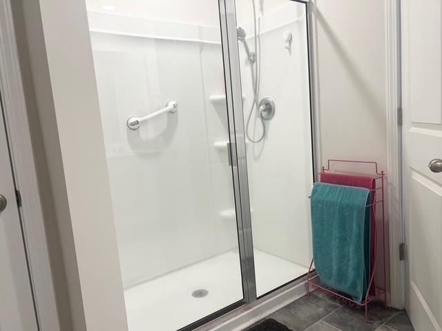 bathroom with a shower stall