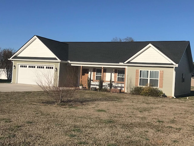 ranch-style home with driveway, a porch, a front lawn, and an attached garage