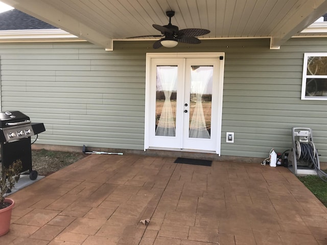 property entrance featuring a ceiling fan, french doors, and a patio