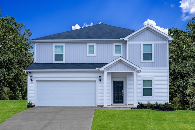 view of front of home with an attached garage, a shingled roof, concrete driveway, a front lawn, and board and batten siding