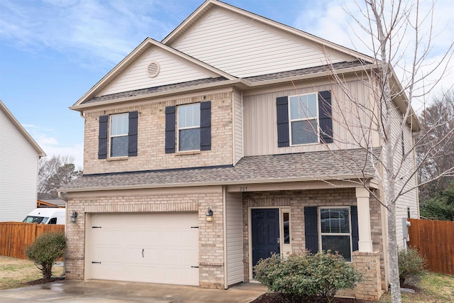 view of front of property featuring brick siding, a shingled roof, concrete driveway, an attached garage, and fence