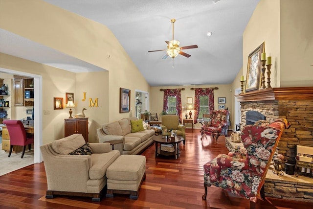 living room with high vaulted ceiling, dark wood-style flooring, a fireplace, and a ceiling fan