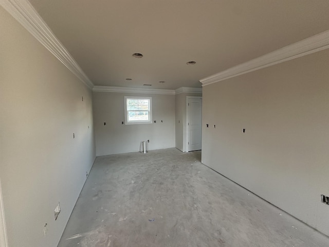 unfurnished room with crown molding