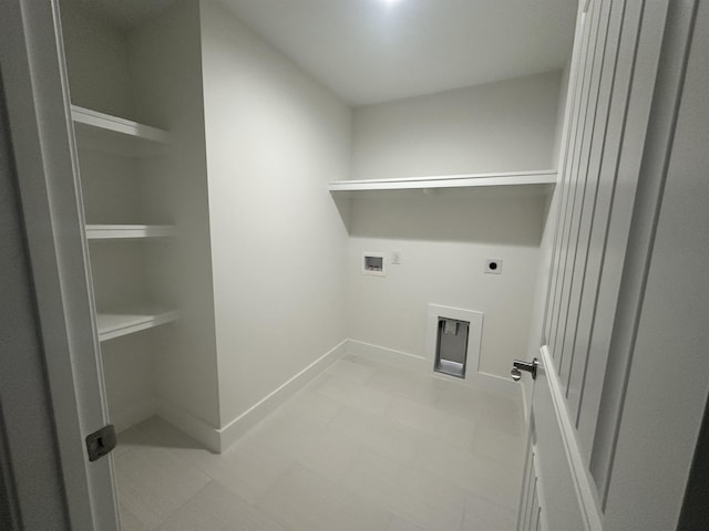 laundry area featuring hookup for a washing machine, laundry area, electric dryer hookup, and baseboards